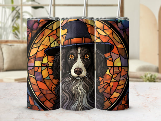 Dog wearing a witch hat, depicted in a stained-glass style on a tumbler.