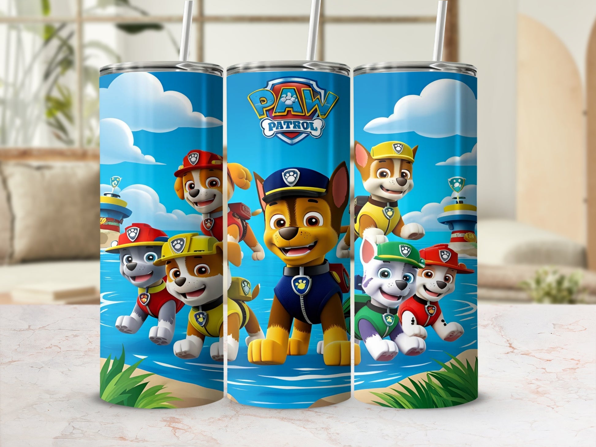 Paw Patrol characters on a blue tumbler with a beach background.