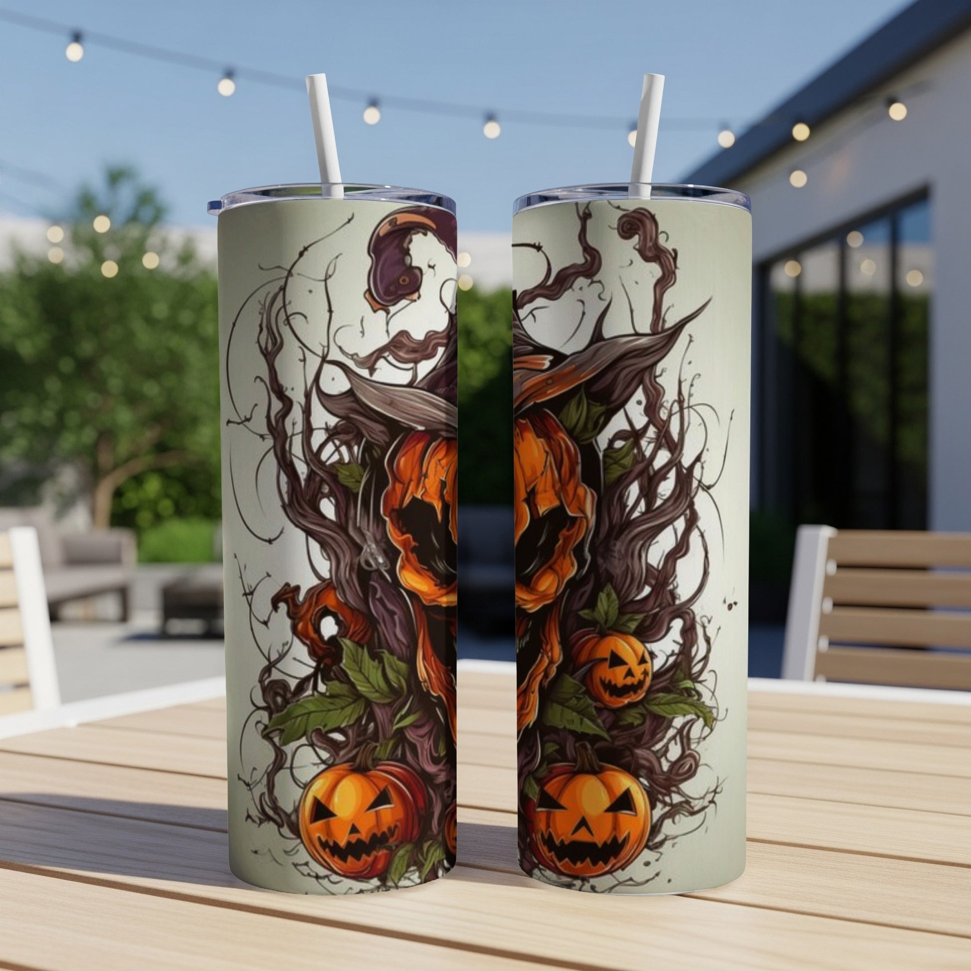 Two tumblers with a Halloween design of jack-o'-lanterns and spooky branches.