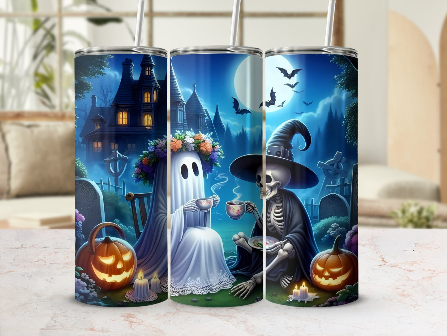 Three tumblers featuring a Halloween graveyard scene with a ghost and skeleton drinking tea.