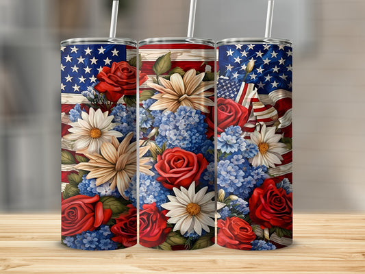 Three tumblers with American flag and floral designs featuring red roses and white daisies.