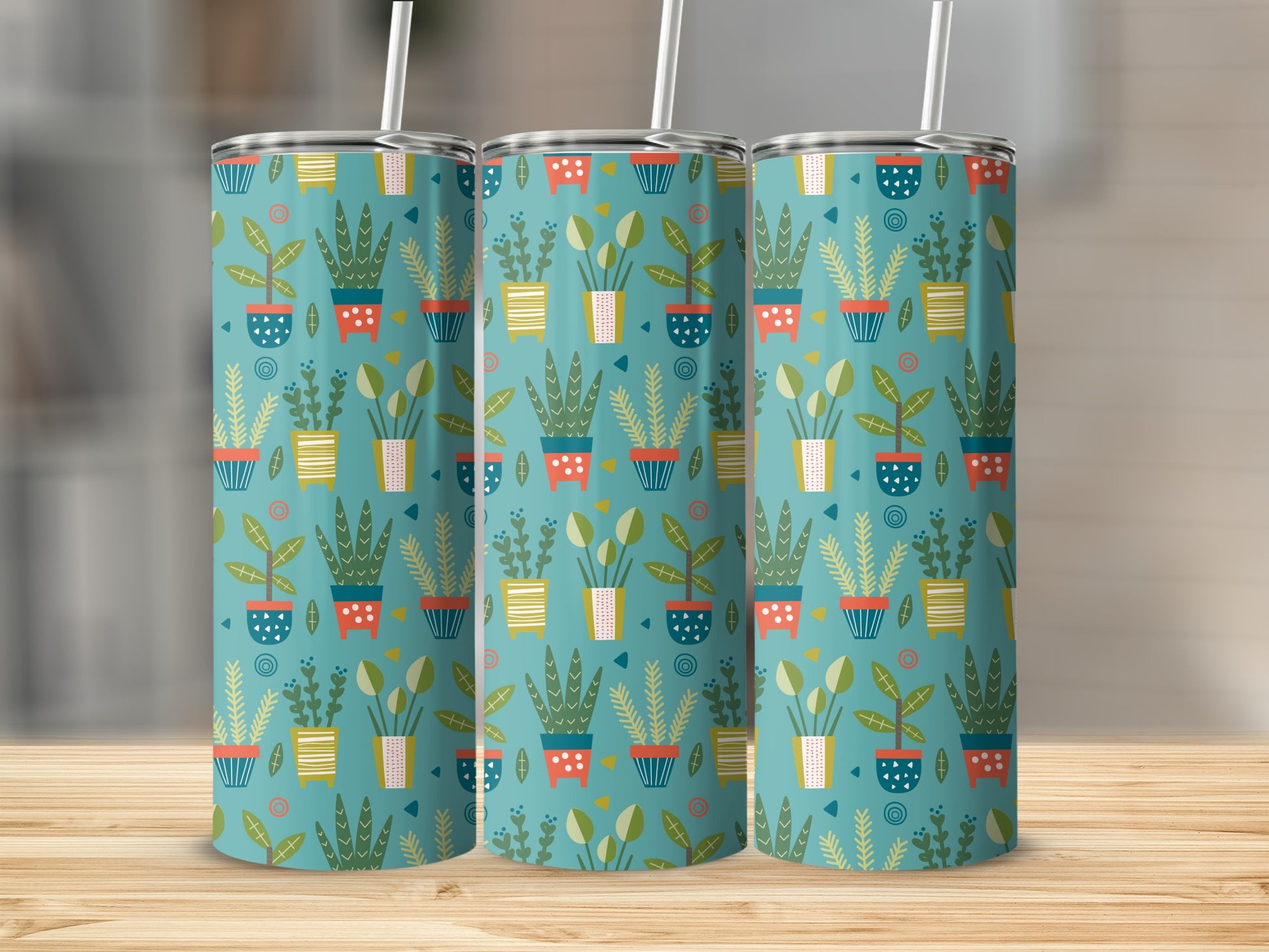 Three tumblers with a teal background and a pattern of potted plants.