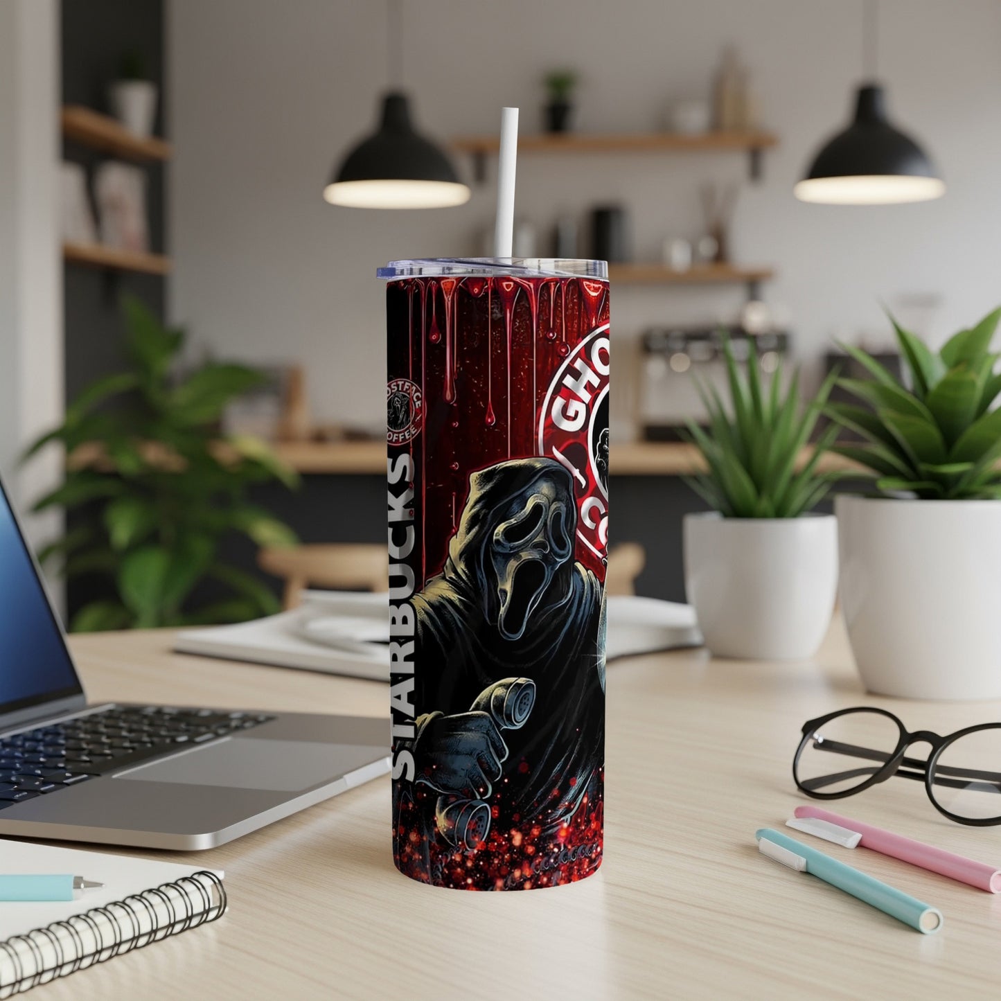 Ghostface from Scream on a Starbucks tumbler with red and black splatter.