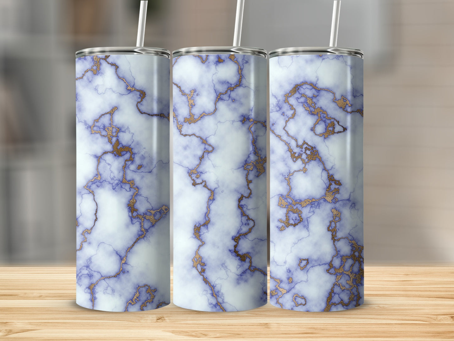 Three tumblers with white, blue, and gold marble pattern.