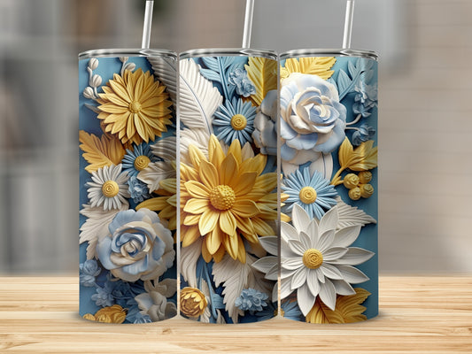 Three blue tumblers with embossed yellow and blue floral designs.