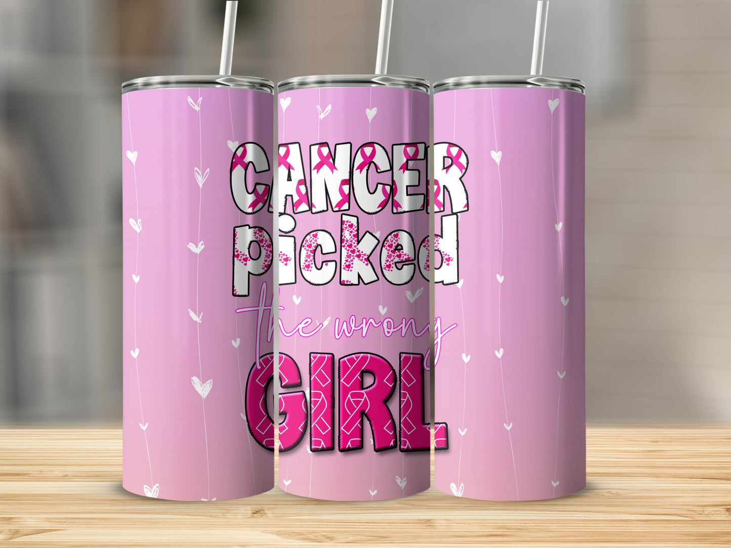 Pink tumbler with "Cancer picked the wrong girl" and breast cancer ribbons.