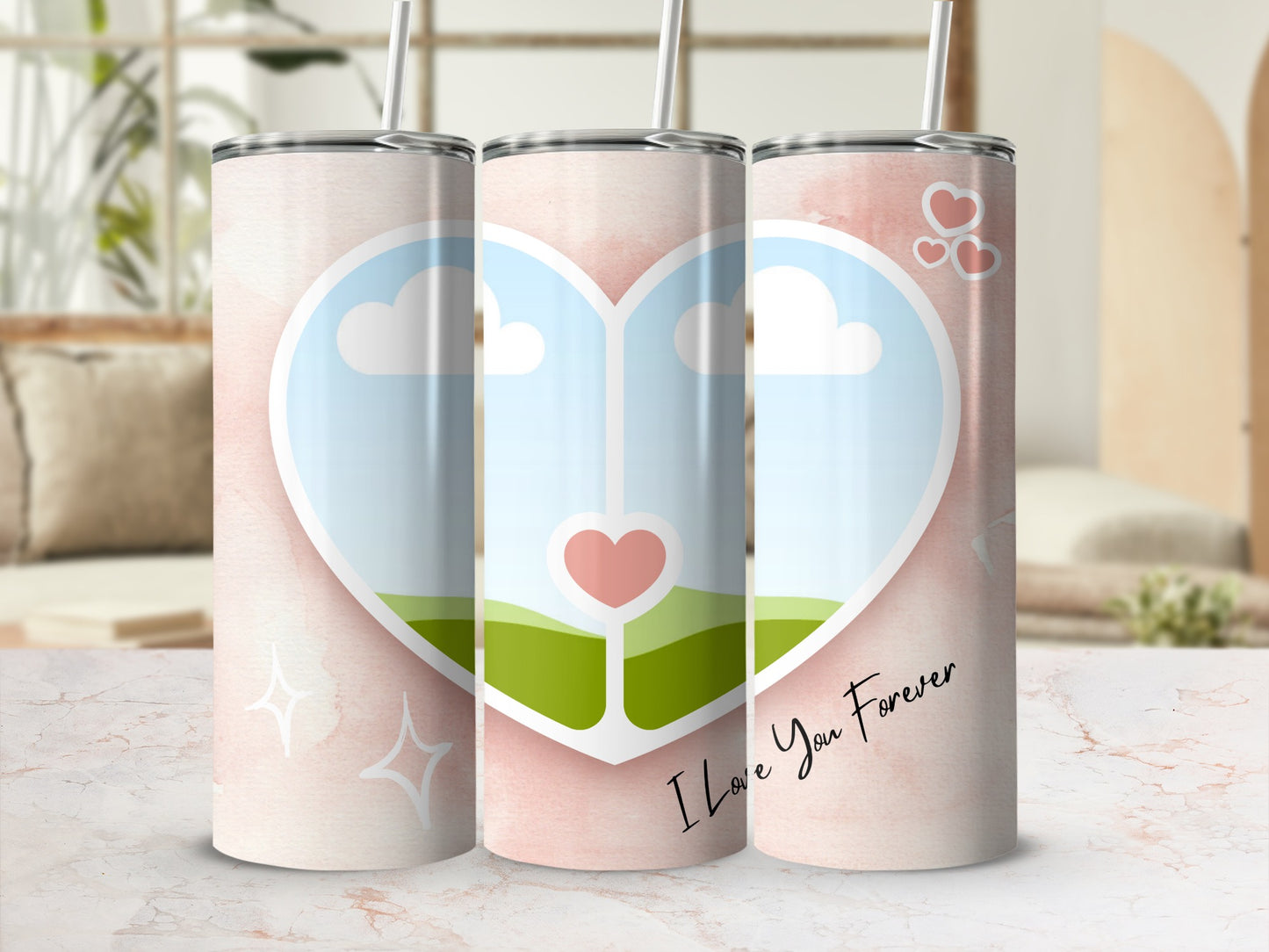 Three tumblers with a pink watercolor background, heart, and clouds, one with text.