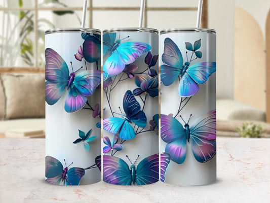 Three tall tumblers with iridescent butterflies and leaves.