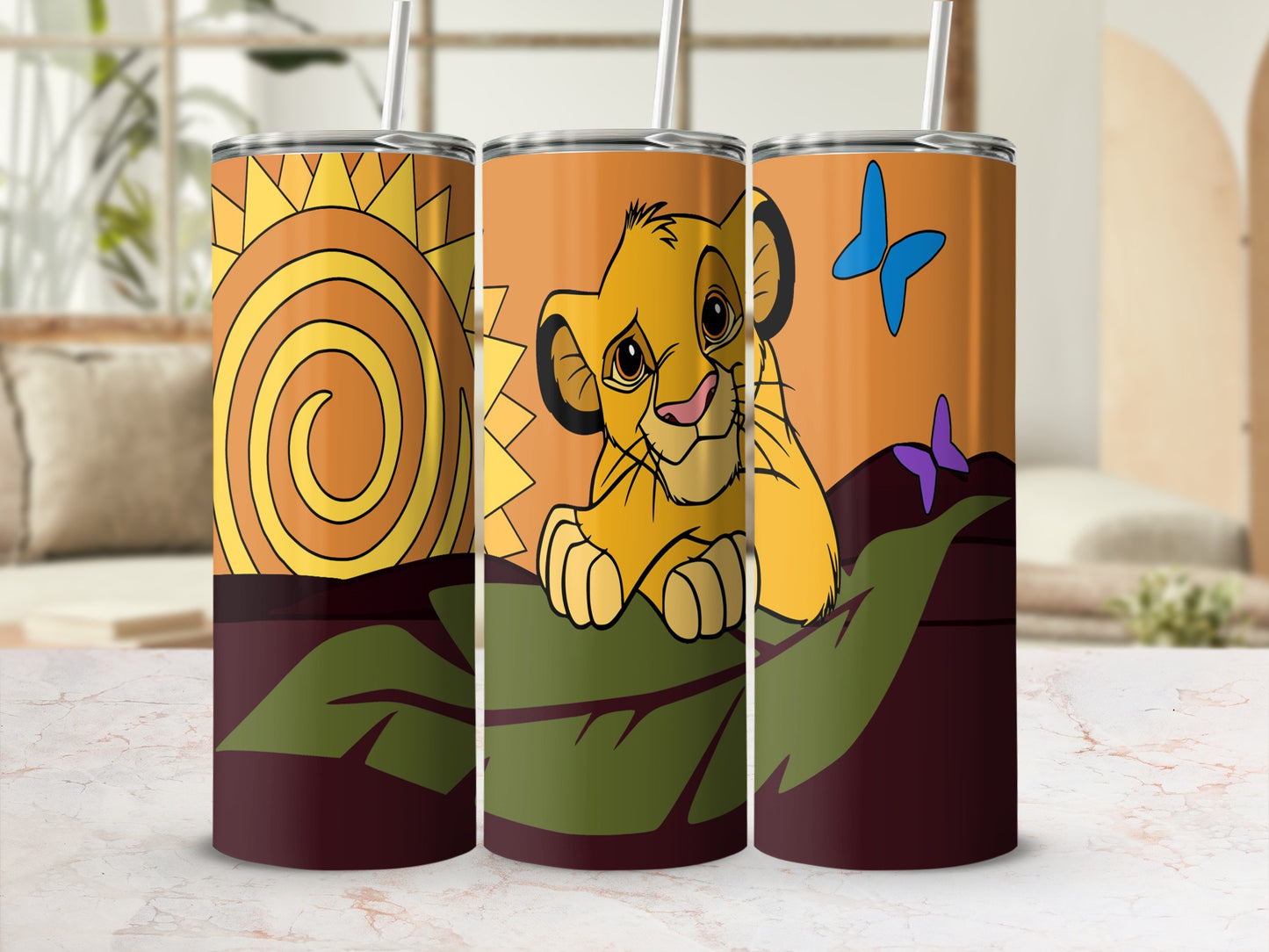 The Lion King's Simba on an orange tumbler with a sun and butterflies.