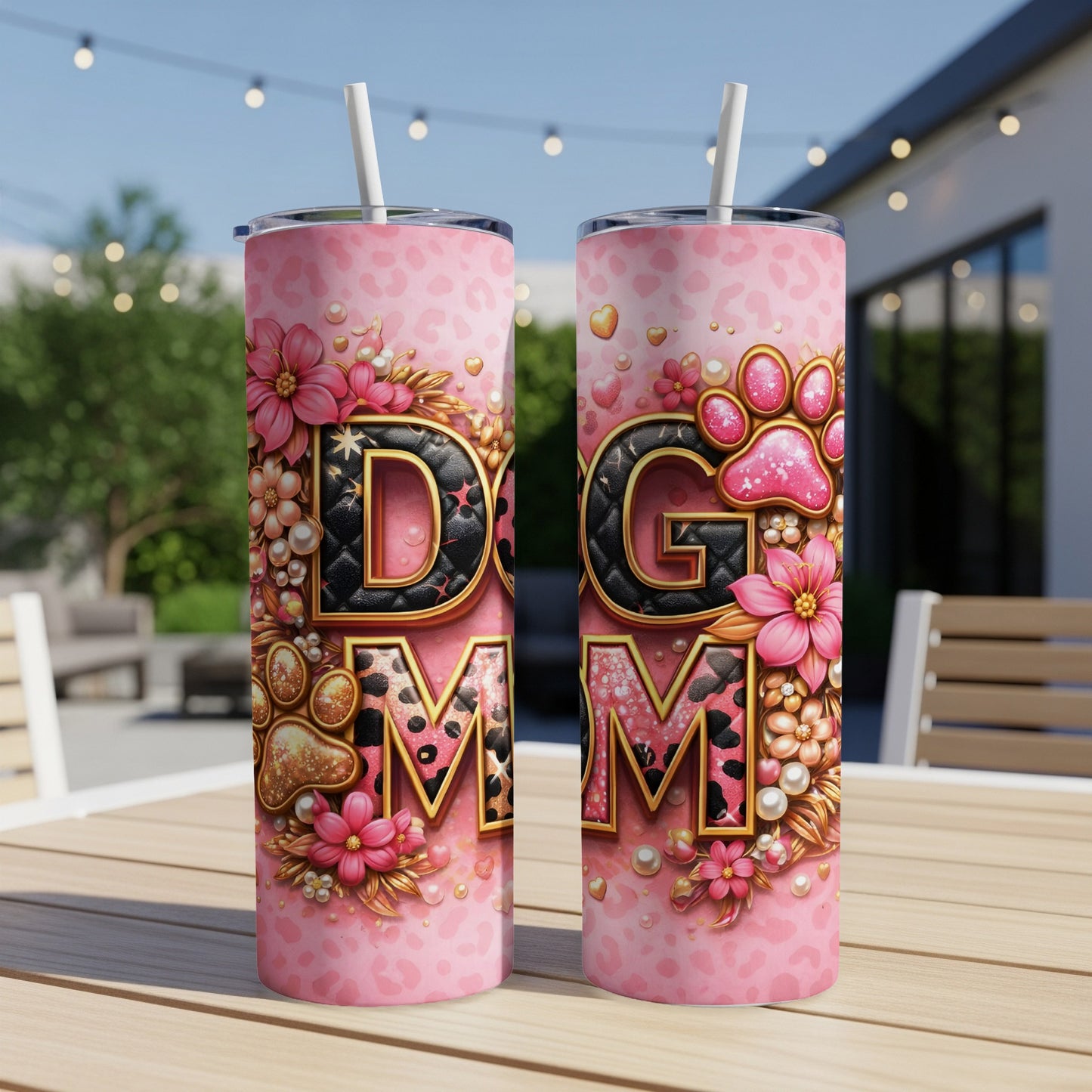 Two pink tumblers with "Dog Mom" text and floral, paw print designs.