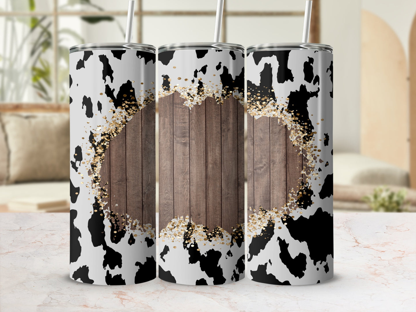 Cow print tumbler with wood grain center and gold glitter accents.