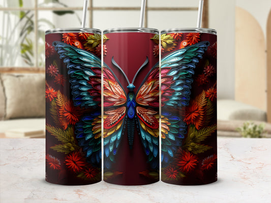 Three tumblers with colorful, ornate butterfly and floral designs.