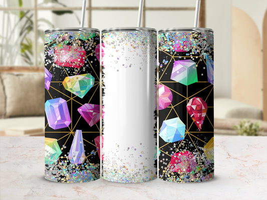 Three tumblers with colorful gemstones and glitter on a black geometric background.