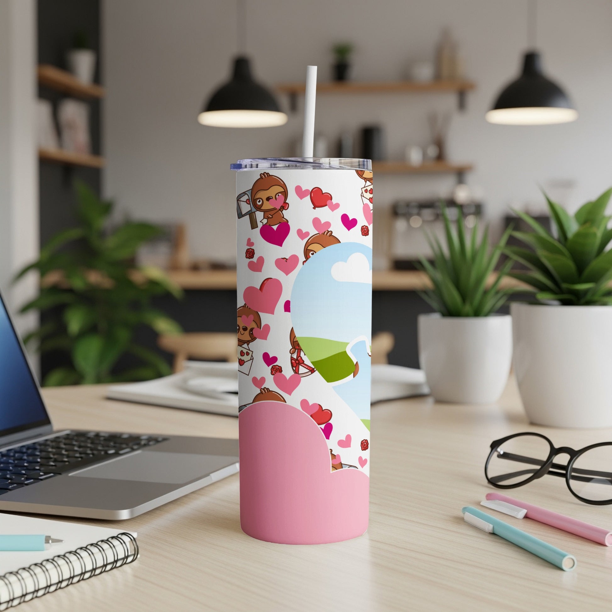 Sloth illustration tumbler with hearts, a straw, and a pink heart design.