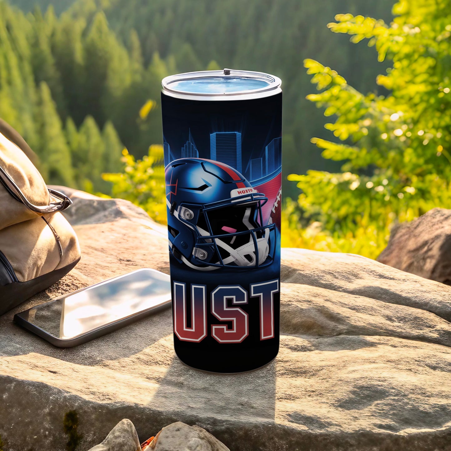 Football helmet and city skyline design on a black stainless steel tumbler.