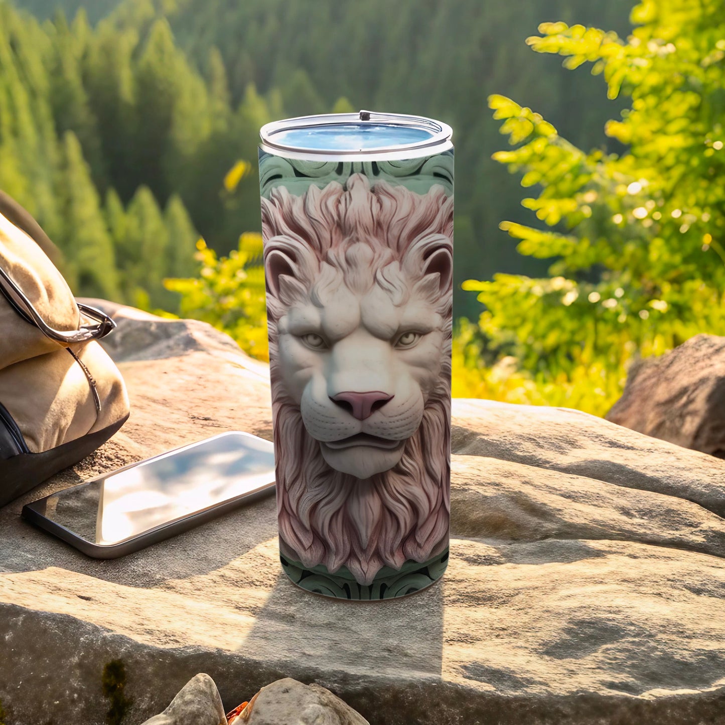 White lion head relief on a patterned tumbler with a smartphone and bag outdoors.