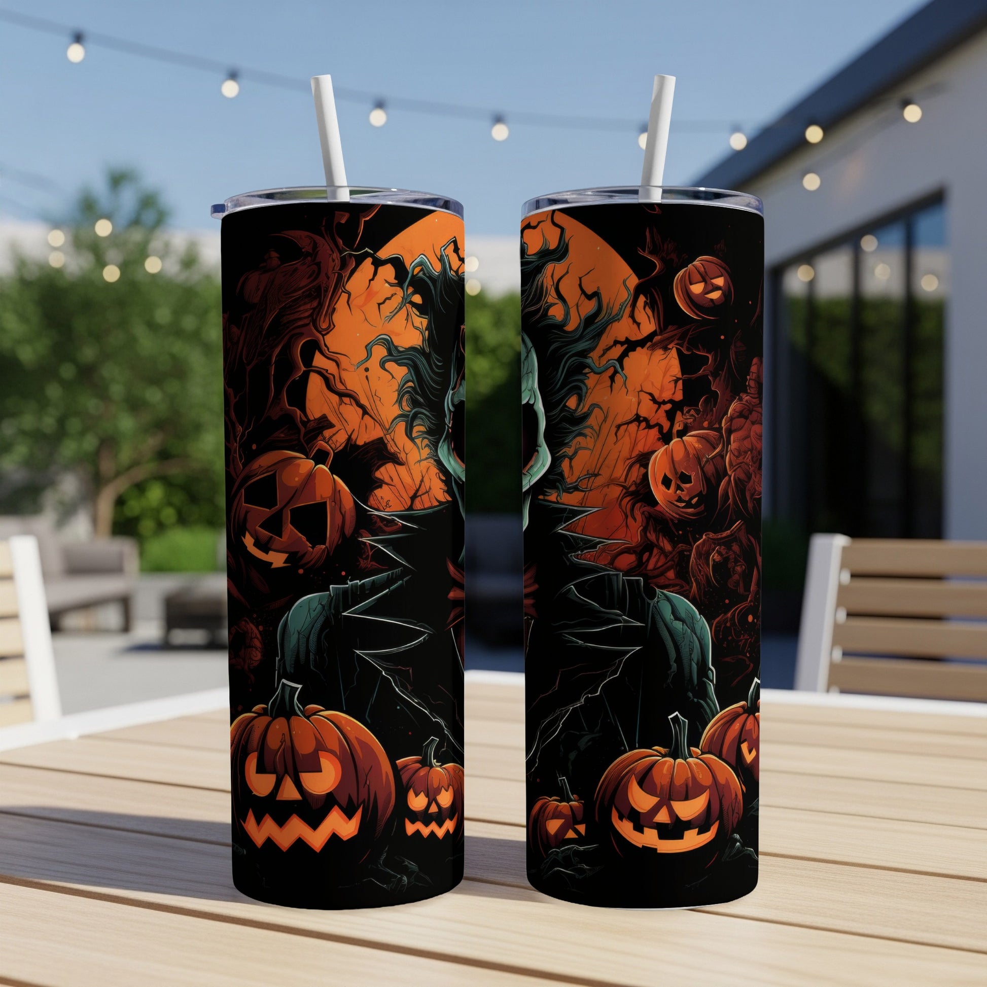 Two Halloween-themed tumblers with spooky designs featuring jack-o'-lanterns and a grim figure.