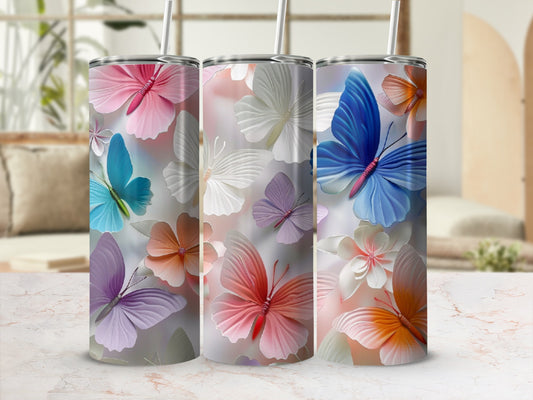 Three tumblers with floral butterfly patterns in soft pastel colors.