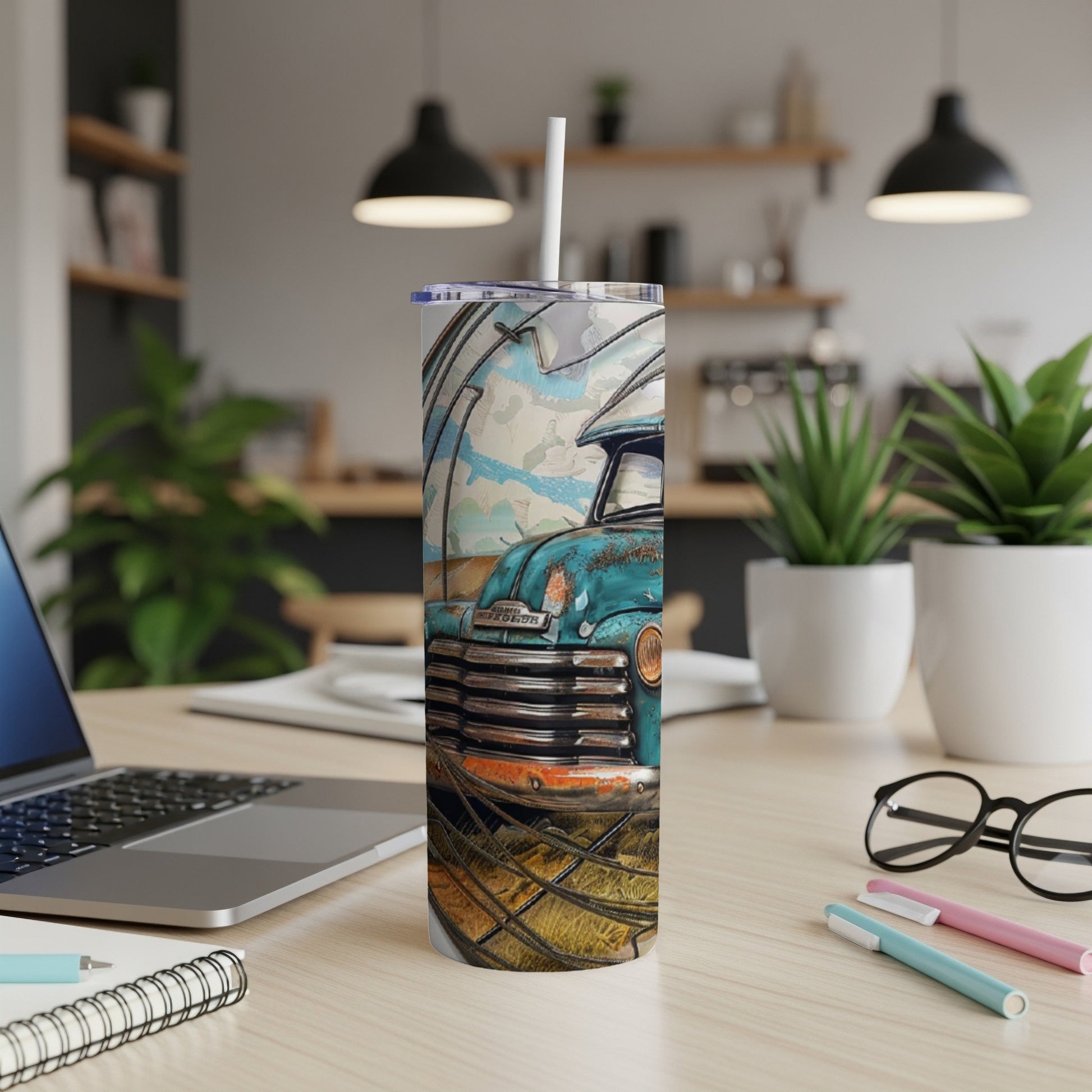 Turquoise vintage truck on a skinny tumbler with straw.