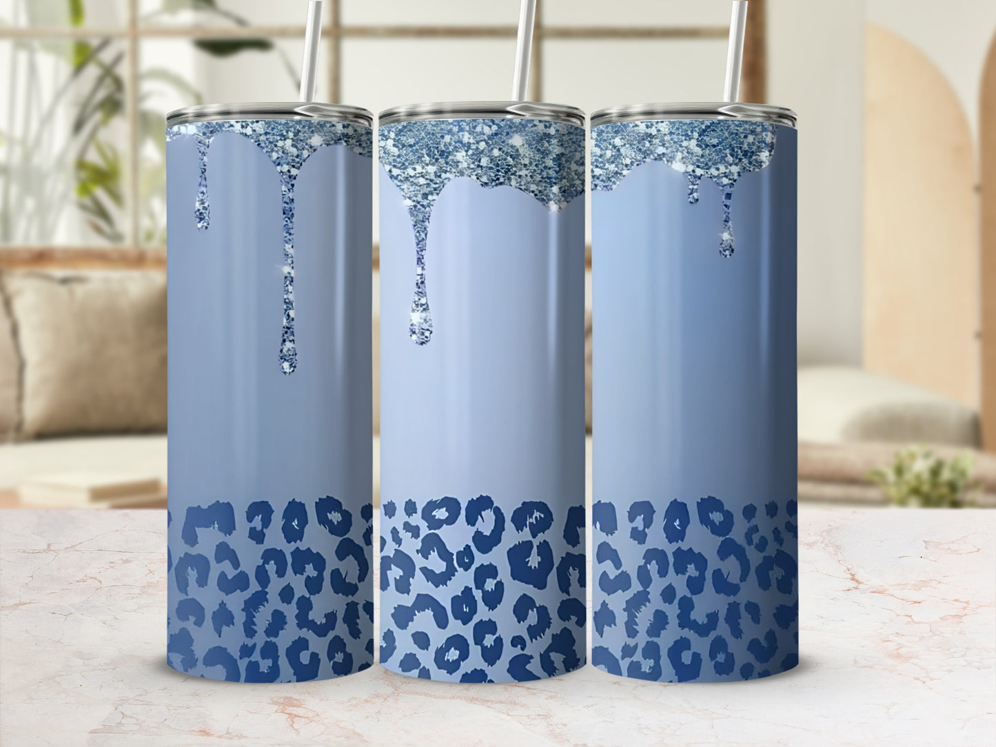 Blue glitter drip tumbler with leopard print, three in a row.