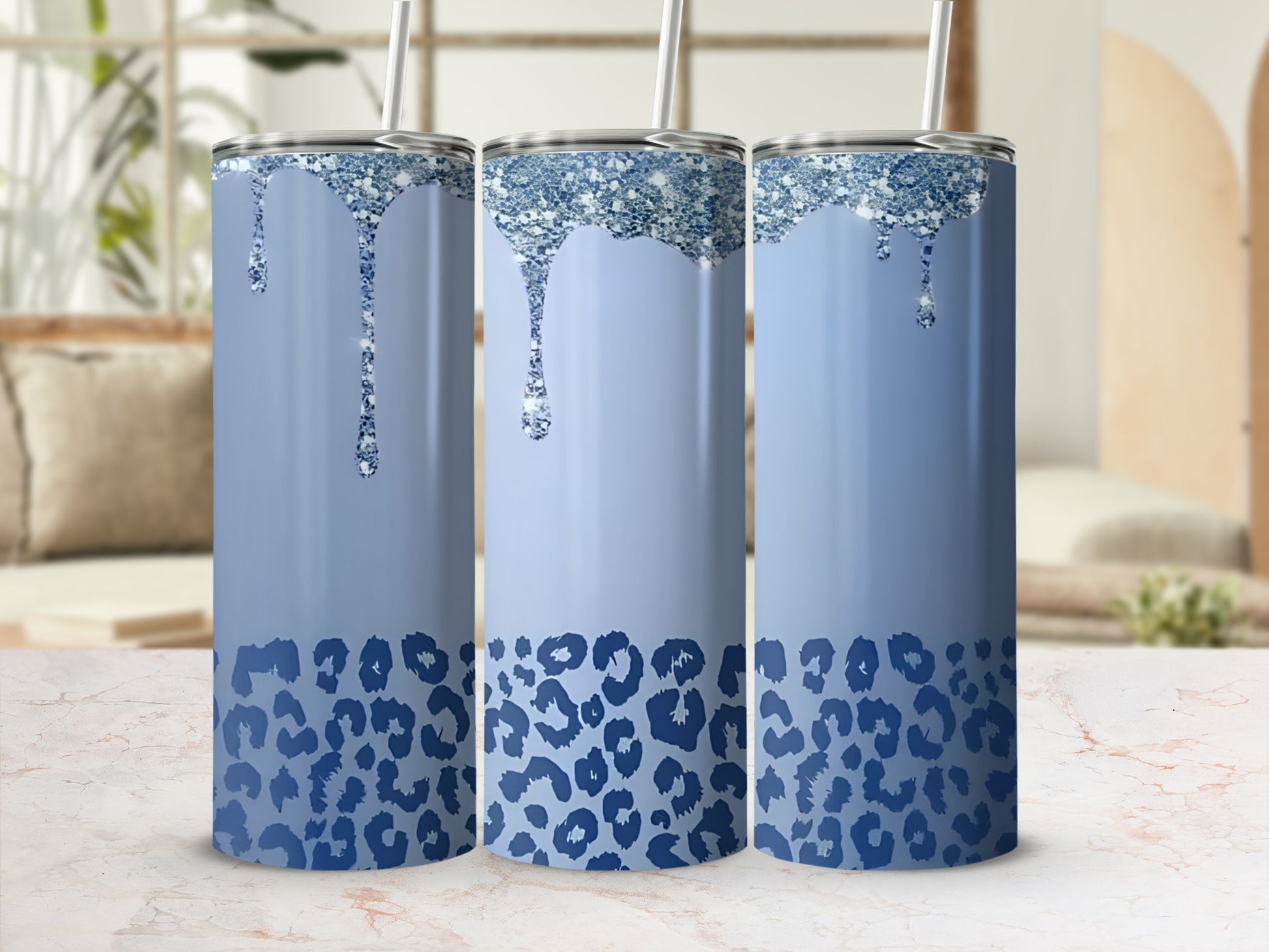 Blue glitter drip tumbler with leopard print, three in a row.