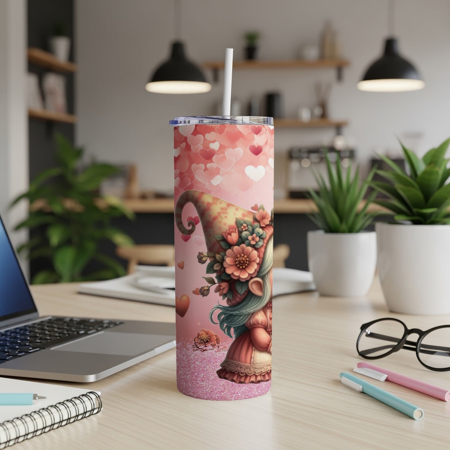 Pink gnome with hearts and flowers on a glittery tumbler with a straw.