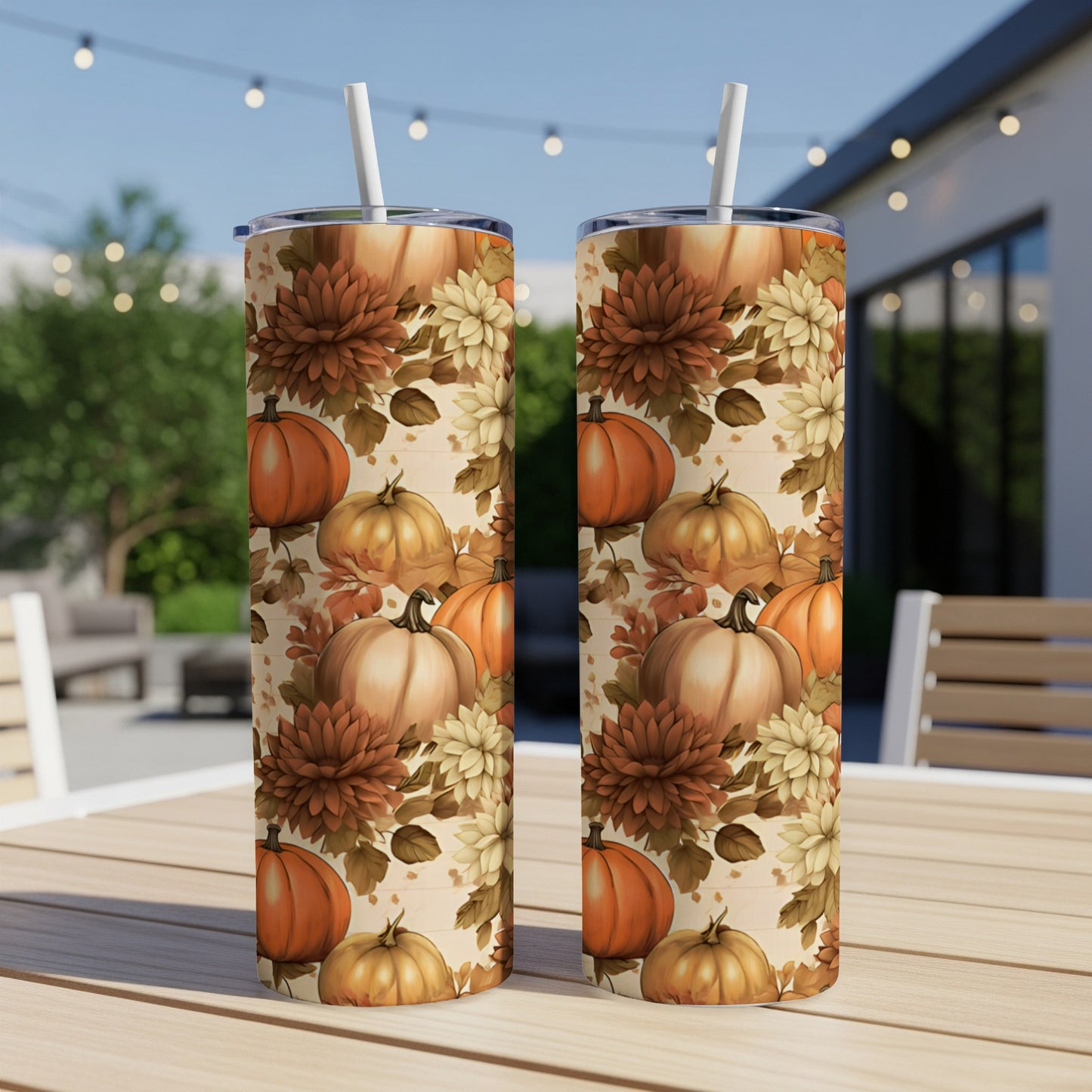 Two tall tumblers with a fall harvest pattern of pumpkins and flowers.