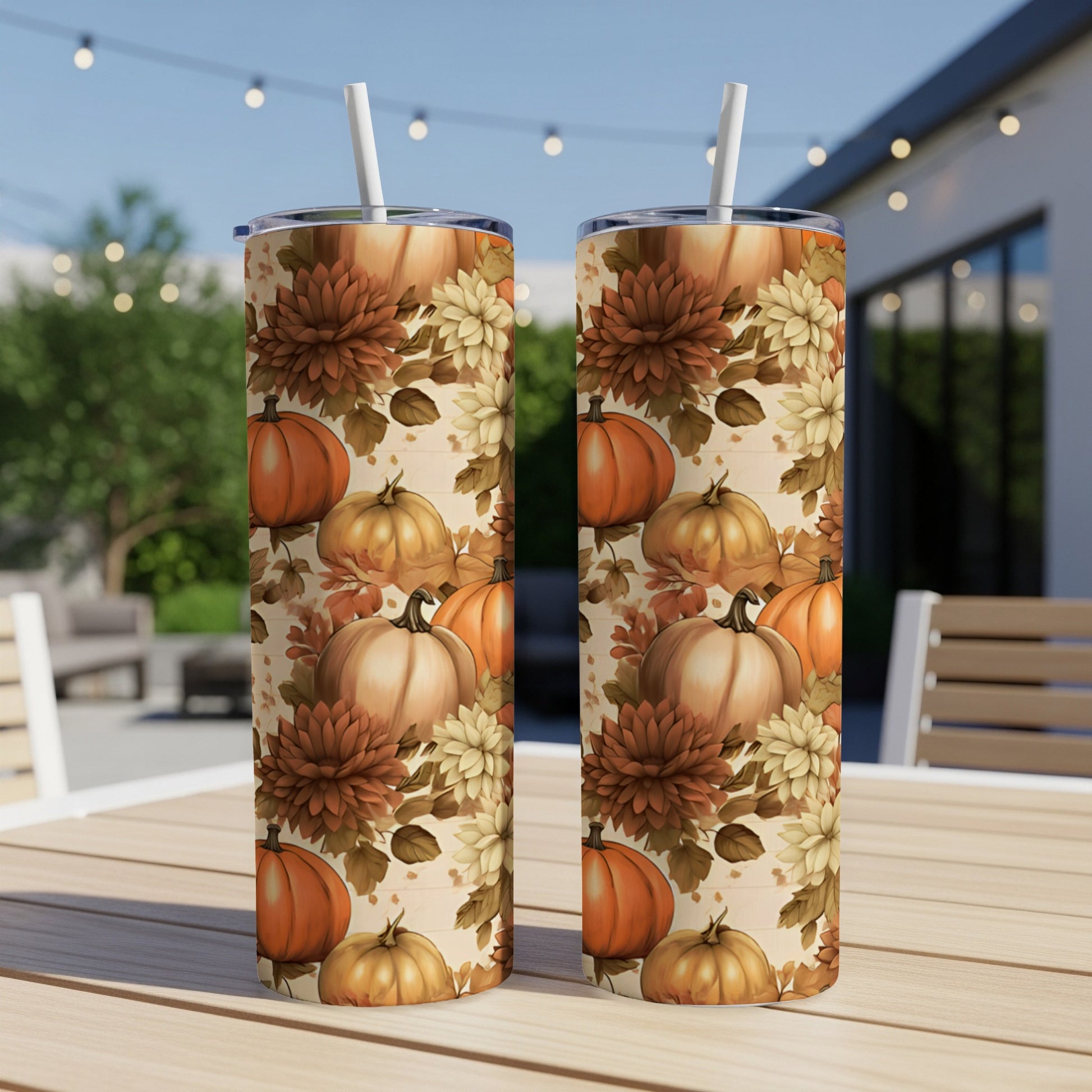Two tall tumblers with a fall harvest pattern of pumpkins and flowers.