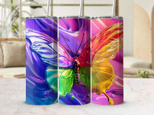 Three tumblers with colorful, abstract butterfly designs.