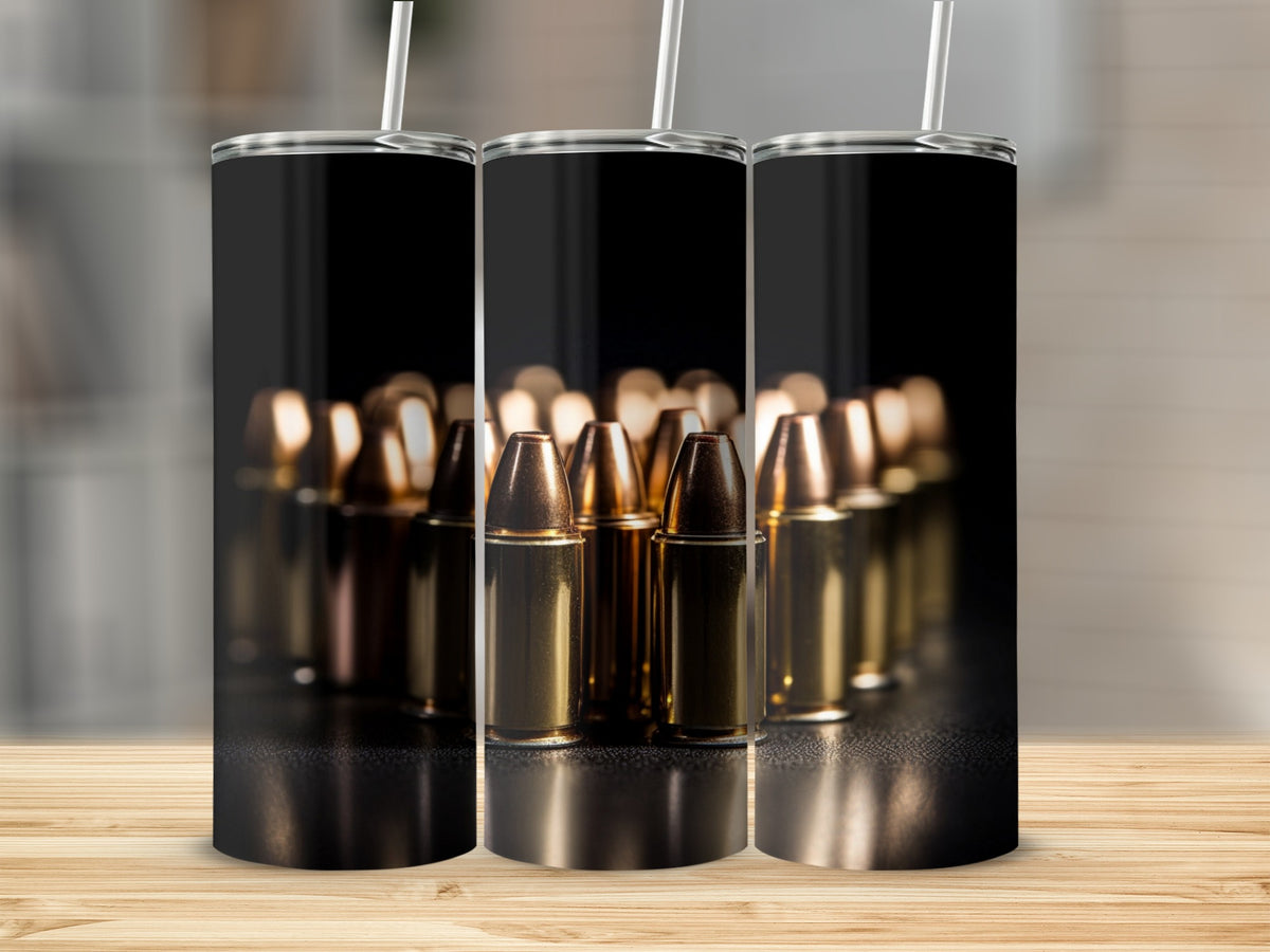Three cylindrical tumblers with lids and straws, printed with a pattern of brass bullets on black.