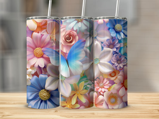 Three tumblers with floral and butterfly designs on a wooden surface.