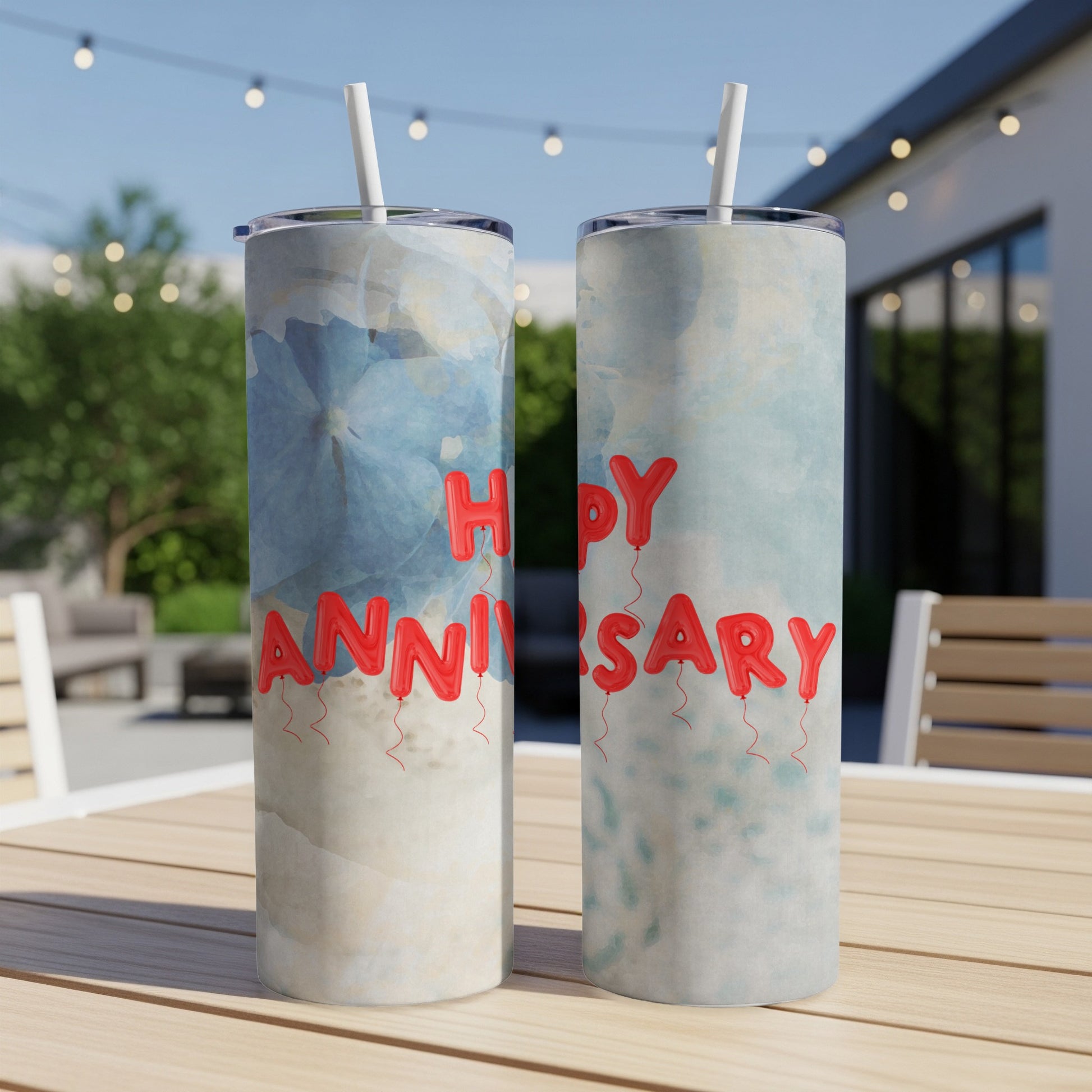 Two tumblers with red balloon letters spelling "Happy Anniversary."