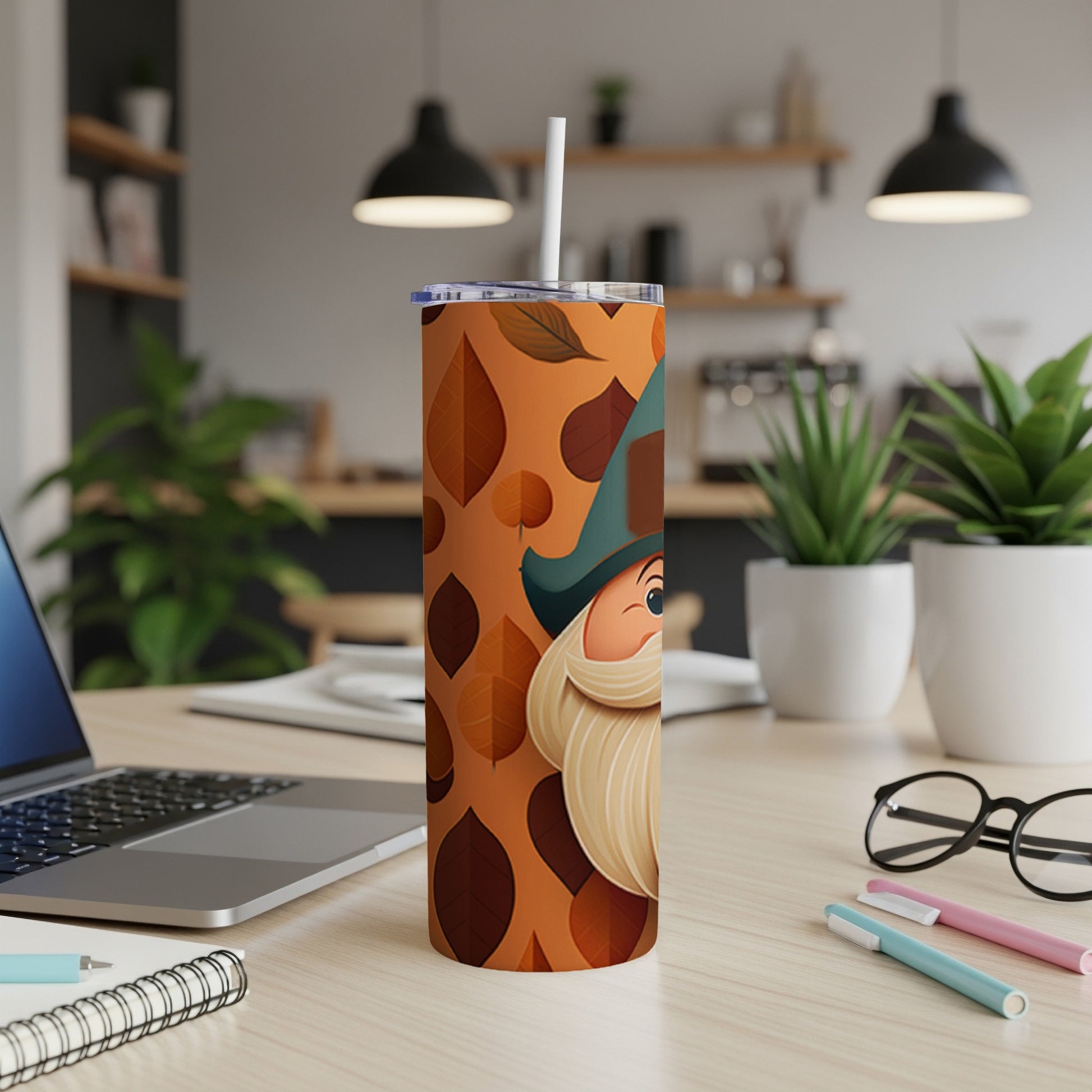 Gnome tumbler with autumn leaf pattern and straw.