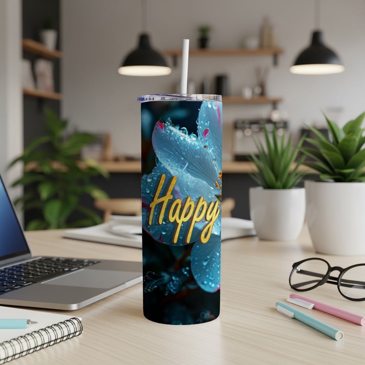 Blue flower with water droplets and "Happy" text on a tumbler.