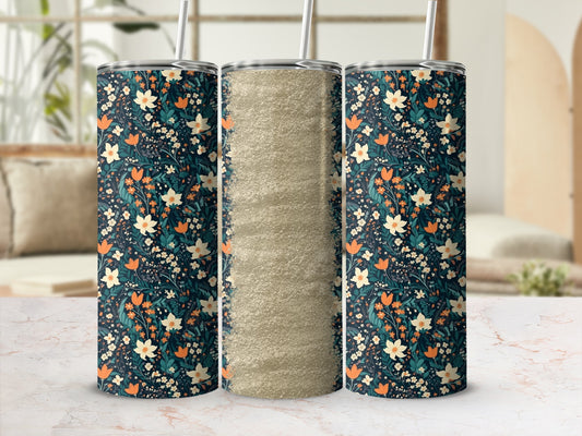 Dark blue floral tumbler with glitter accent and straw.