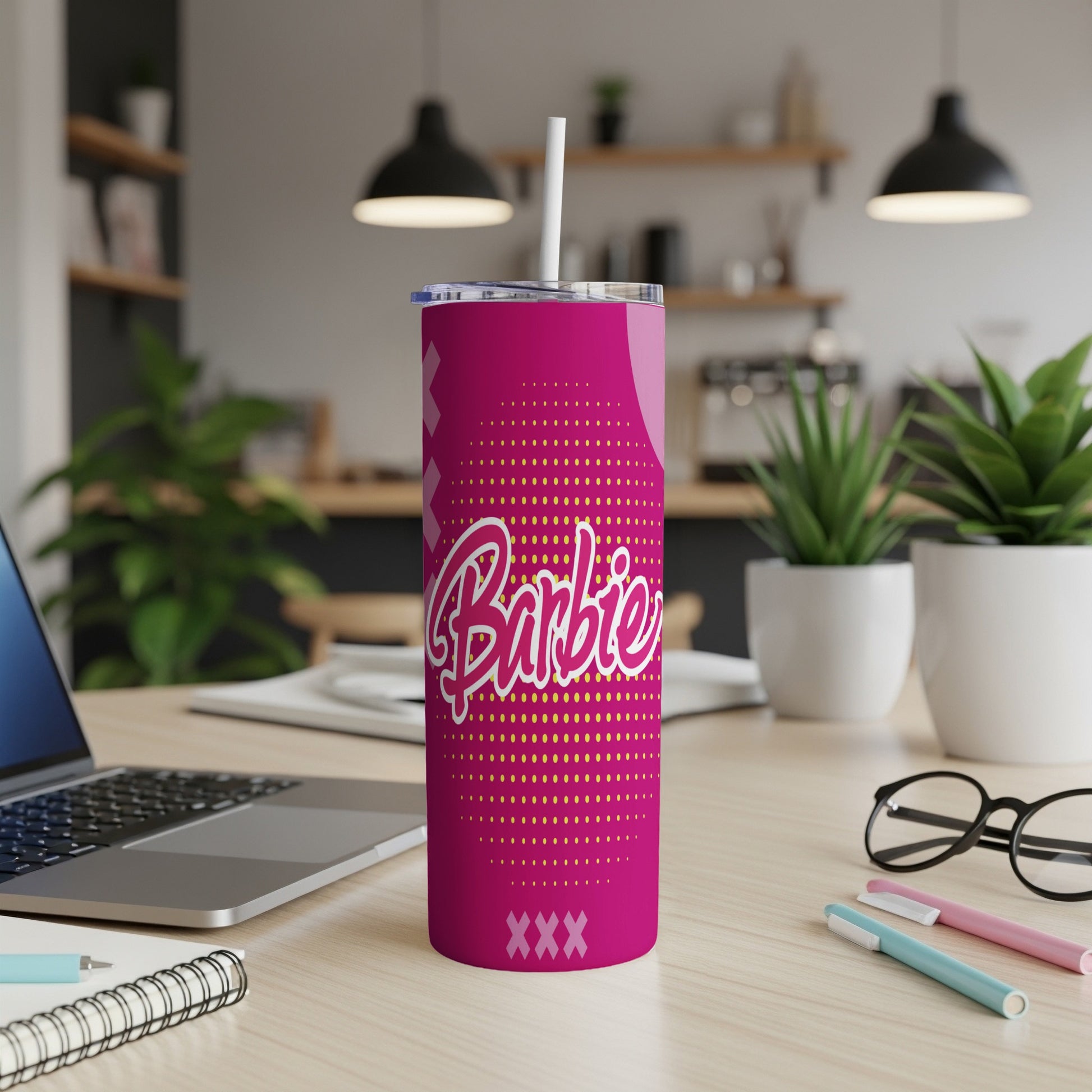 Pink Barbie tumbler with white straw and "Barbie" logo.