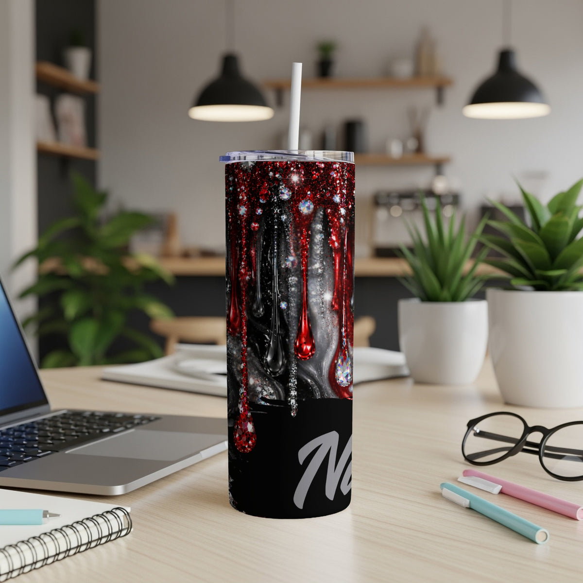 Black tumbler with red drips, glitter, diamonds, and "Nev" text.