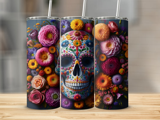 Floral skull tumbler with colorful flowers and details on a wooden surface.