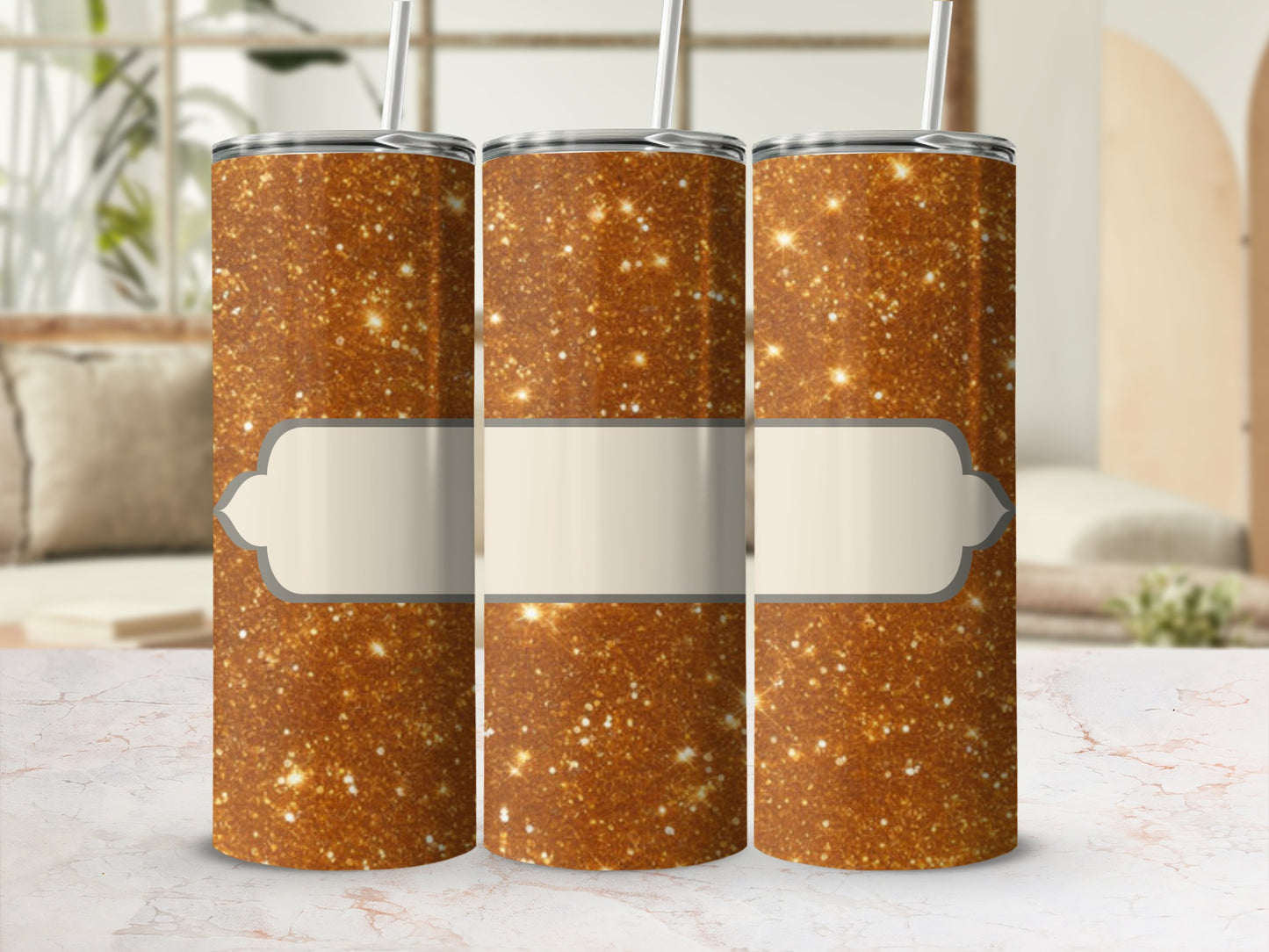 Three gold glitter tumblers with a light tan label.
