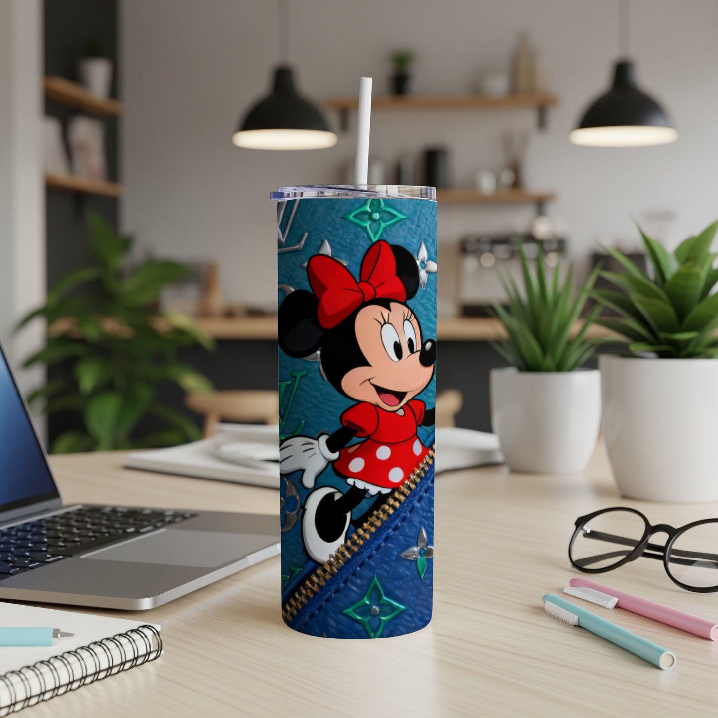Minnie Mouse on a blue faux-leather tumbler with a zipper detail.