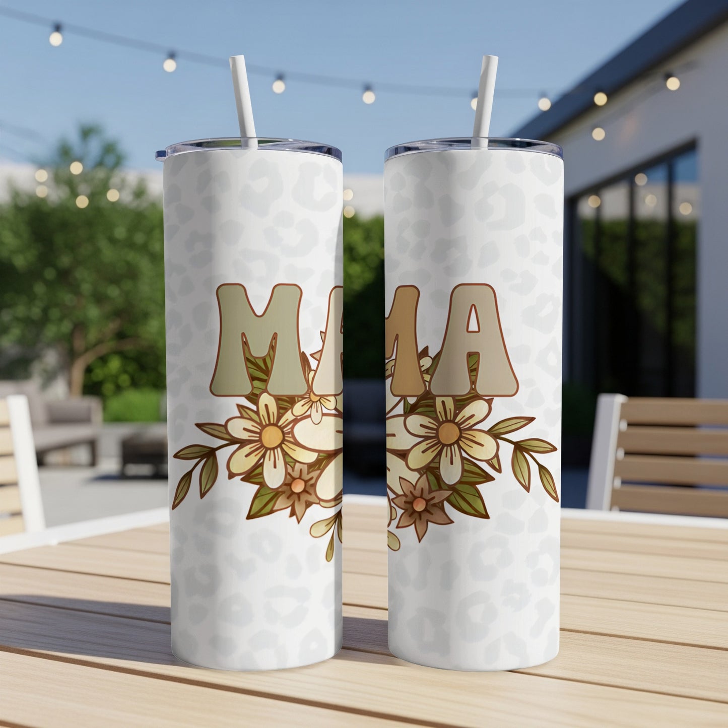 Two tumblers with "MAMA" text and floral design on a table.
