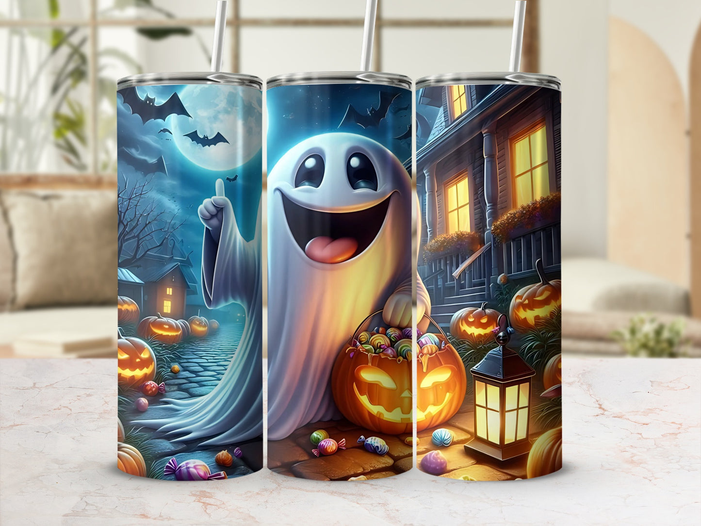 Three tumblers with Halloween-themed wraparound art featuring ghosts, pumpkins, bats, and candy.