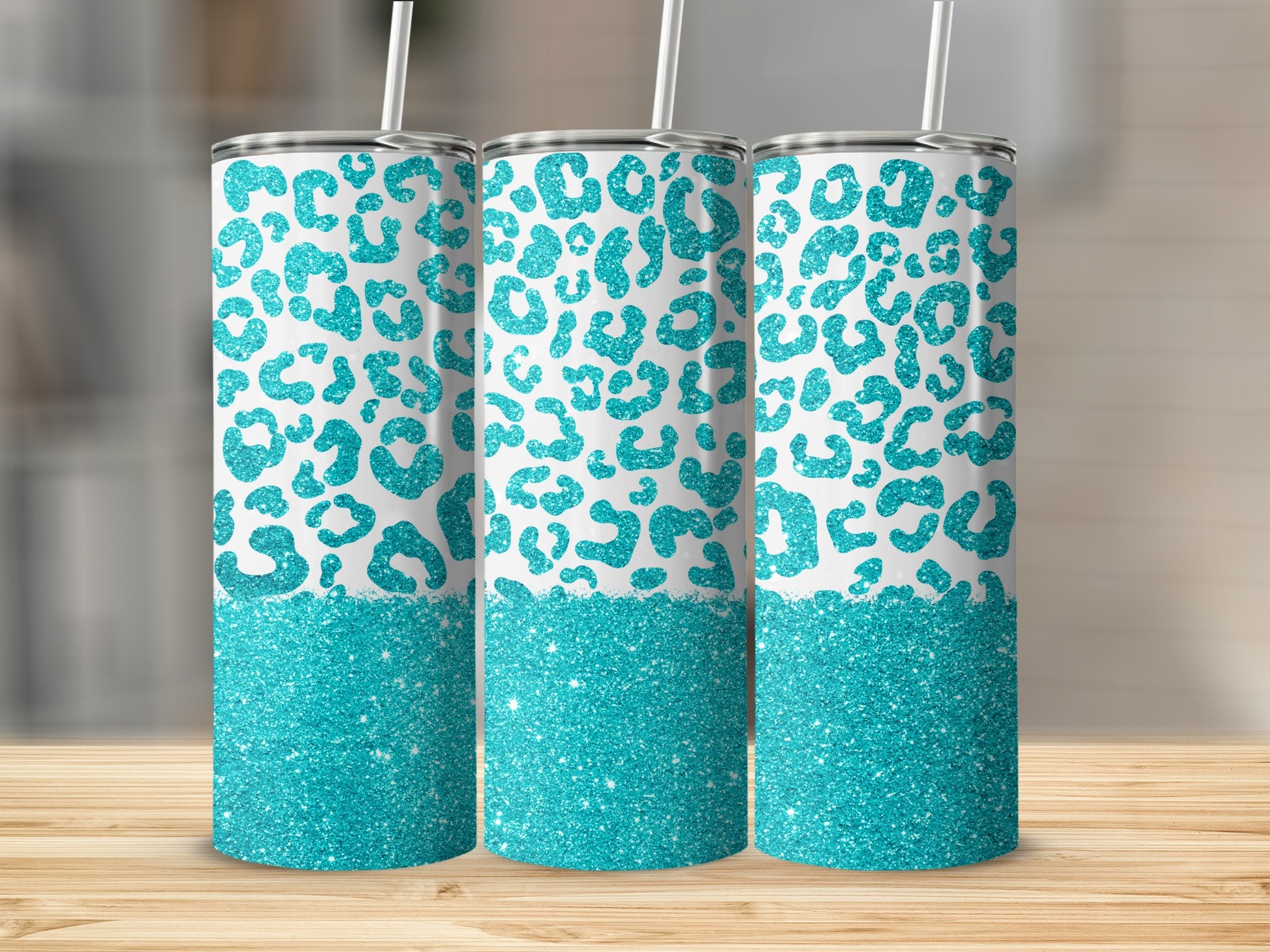 Three tumblers with teal leopard print and glitter bottom.
