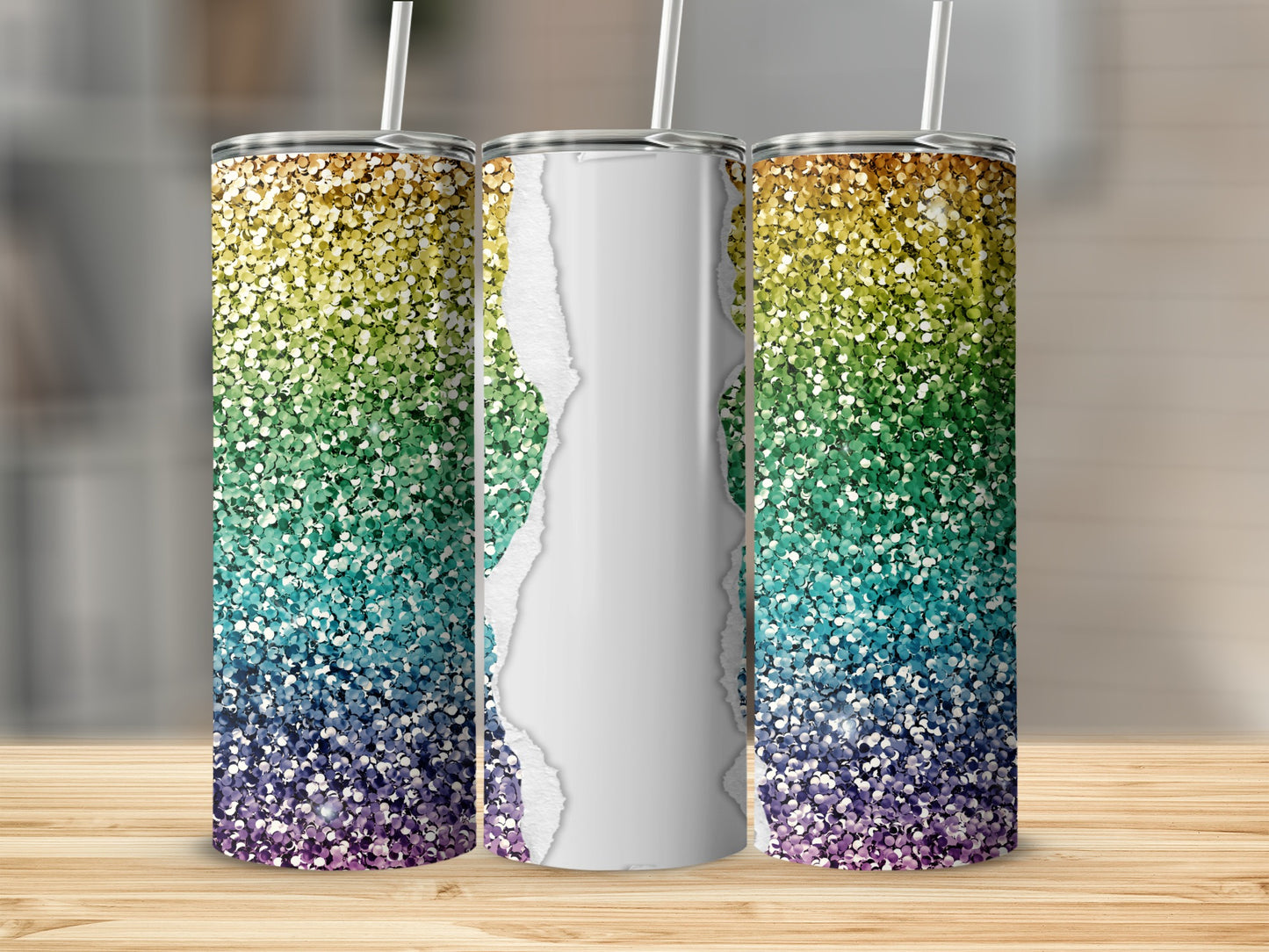 Rainbow glitter tumbler with torn paper design, shown on a wooden surface.