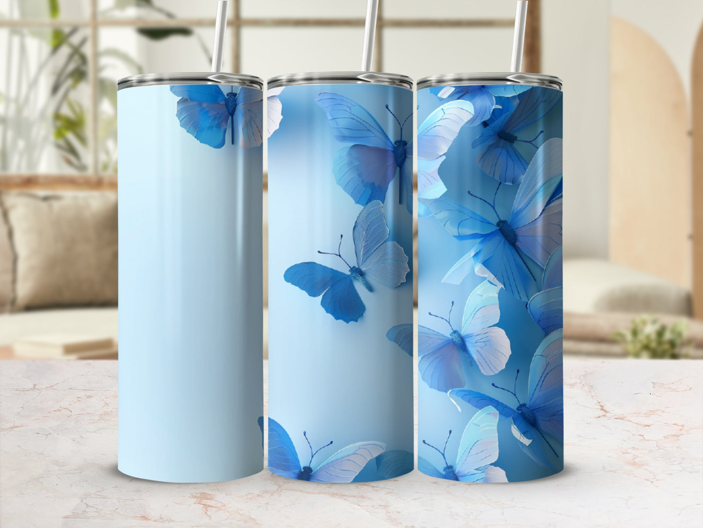 Light blue tumbler with delicate blue butterflies and white straws.