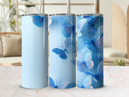 Light blue tumbler with delicate blue butterflies and white straws.