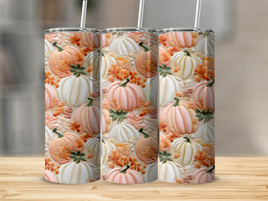 Three tumblers with a pattern of embossed pumpkins and fall leaves.