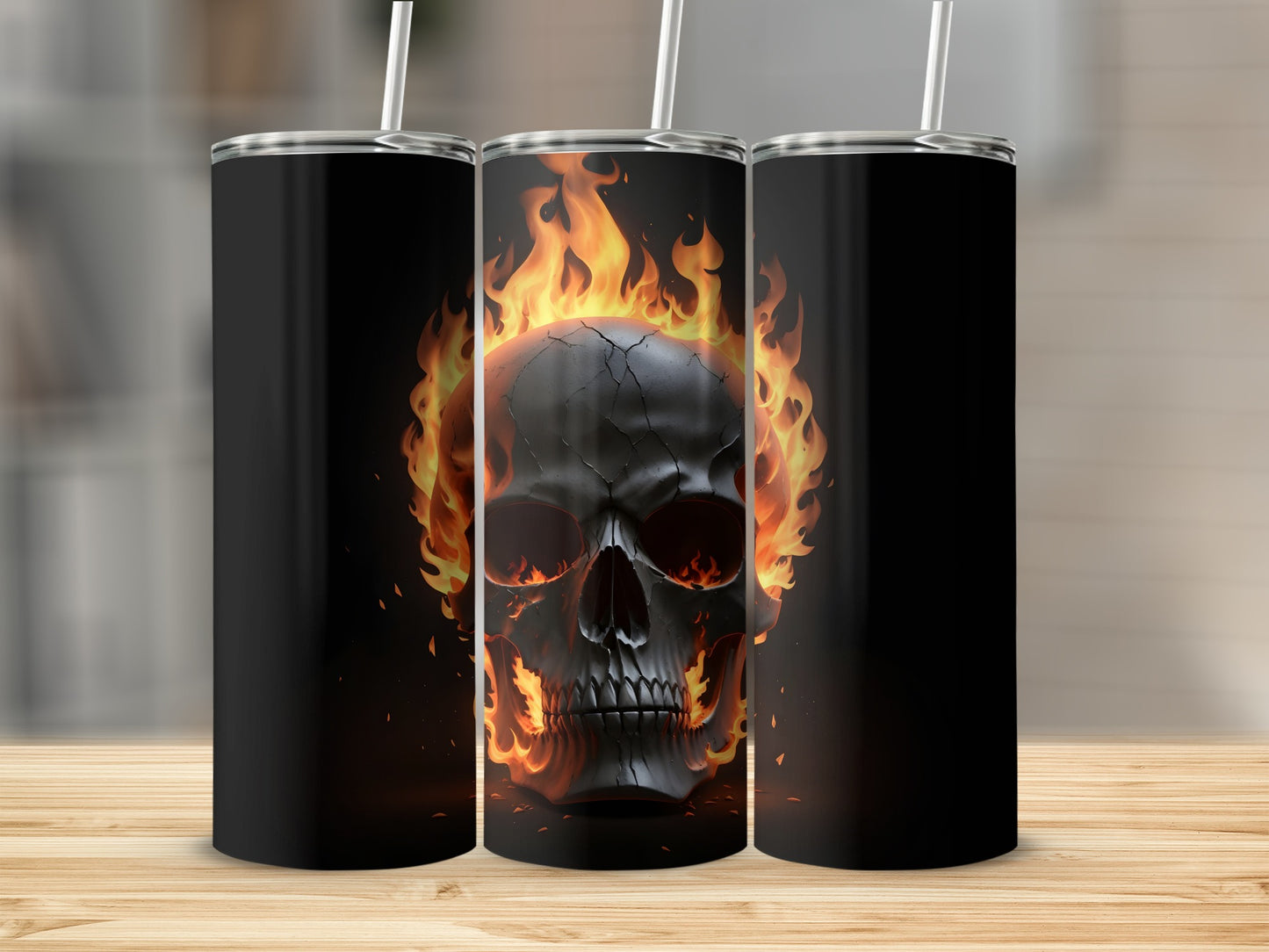 Three black tumblers with a flaming skull design.