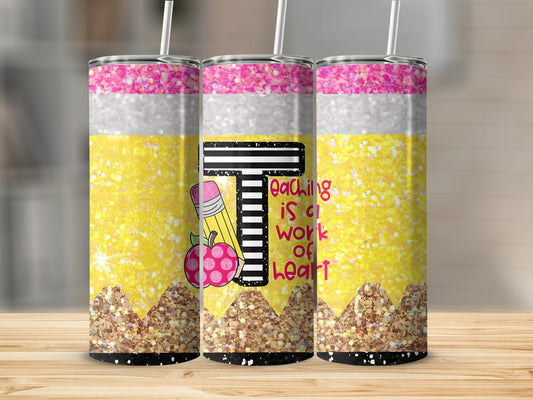 Tumbler with pencil design and "Teaching is a work of heart" text.