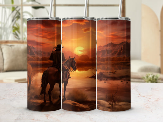 Cowboy on horseback at sunset overlooking a serene landscape.
